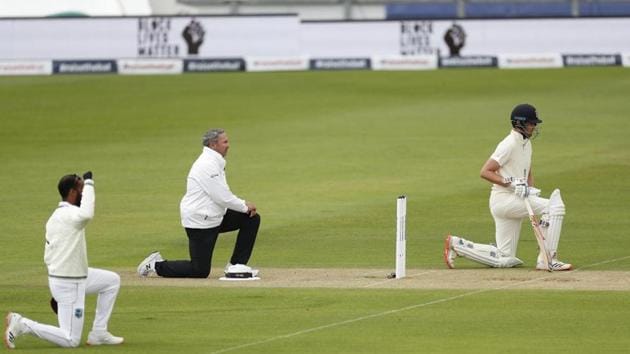 Cricket stars bend their knees during Test match between England and West Indies.(Reuters)