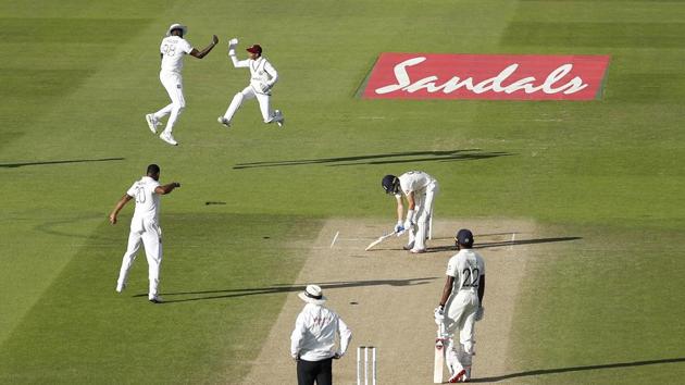 West Indies players celebrates the dismissal of England's Dom Bess, second right, during the fourth day of the first cricket Test match between England and West Indies, at the Ageas Bowl in Southampton, England, Saturday, July 11, 2020. (Adrian Dennis/Pool via AP) (AP)