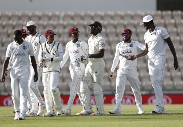 England's Jofra Archer, center, walks off the field with West Indies players at the end of the fourth day of the first cricket Test match between England and West Indies, at the Ageas Bowl in Southampton, England, Saturday, July 11, 2020. (Adrian Dennis/Pool via AP) (AP) England's Jofra Archer, center, walks off the field with West Indies players at the end of the fourth day of the first cricket Test match between England and West Indies, at the Ageas Bowl in Southampton, England, Saturday, July 11, 2020. (Adrian Dennis/Pool via AP) (AP)