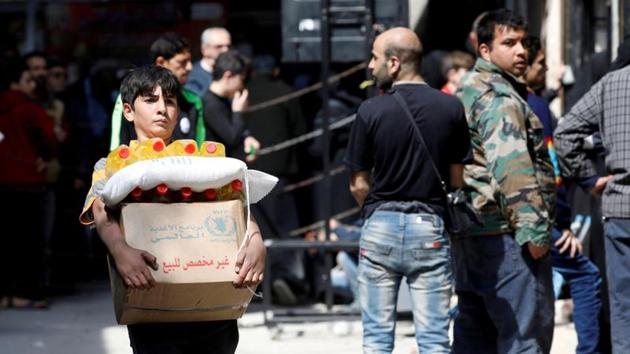A boy holds a cardboard box of food aid received from World Food Programme in Aleppo's Kalasa district, Syria. (REUTERS/For Representative Purposes Only) A boy holds a cardboard box of food aid received from World Food Programme in Aleppo's Kalasa district, Syria. (REUTERS/For Representative Purposes Only)