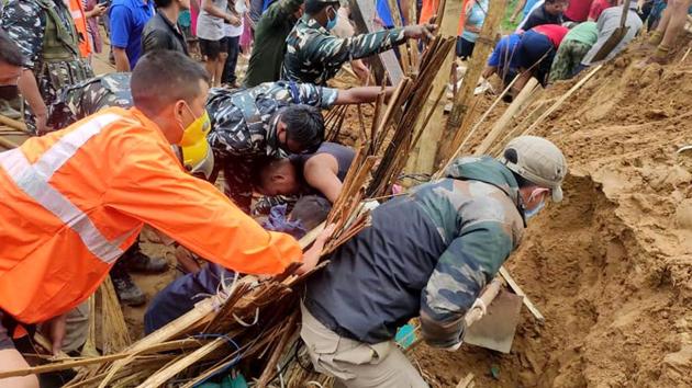 Search and rescue operation underway after four people were buried following a landslide due to incessant rainfall, at Modirijo in Arunachal Pradesh on Friday. (ANI Photo) Search and rescue operation underway after four people were buried following a landslide due to incessant rainfall, at Modirijo in Arunachal Pradesh on Friday. (ANI Photo)