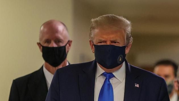 The American president had refused to wear a mask in public, triggering a political war about facial coverings (REUTERS) The American president had refused to wear a mask in public, triggering a political war about facial coverings (REUTERS)
