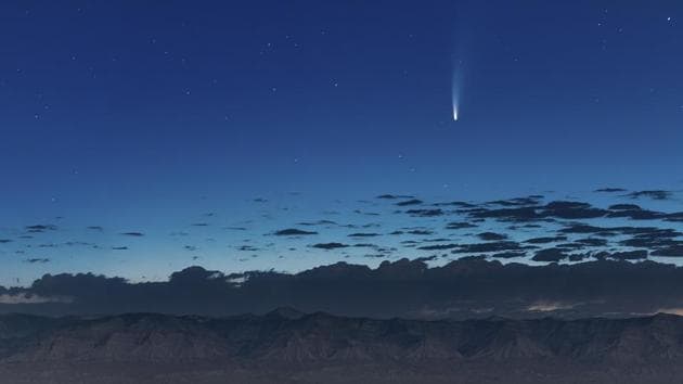 Comet Neowise soars in the horizon of the early morning sky seen from near the grand view lookout at the Colorado National Monument west of Grand Junction, Colo., Thursday, July 9, 2020.(Photo Credit: Conrad Earnest via AP)
