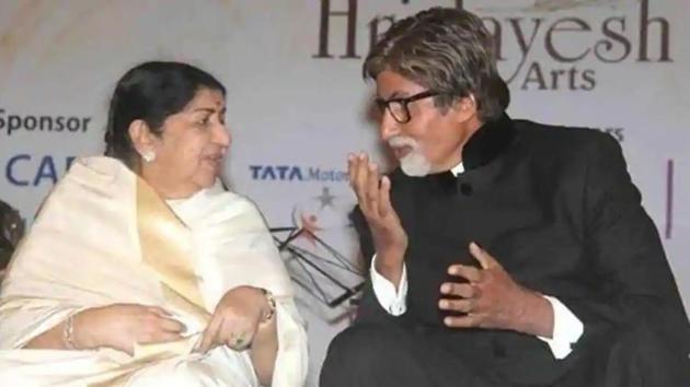 Lata Mangeshkar and Amitabh Bachchan interact.