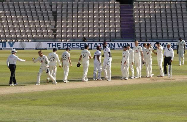 West Indies batsmen, center, greet England players after winning the first cricket Test match between England and West Indies, at the Ageas Bowl in Southampton, England, Sunday, July 12, 2020. (Adrian Dennis/Pool via AP) (AP)