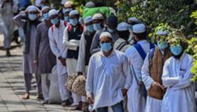 File photo of those who took part in a Tablighi Jamaat function in Delhi in March, 2020, walking to board buses taking them to a quarantine facility. (Biplov Bhuyan/HT File Photo) File photo of those who took part in a Tablighi Jamaat function in Delhi in March, 2020, walking to board buses taking them to a quarantine facility. (Biplov Bhuyan/HT File Photo)