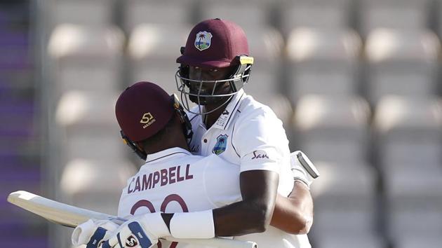 Southampton : West Indies captain Jason Holder, right, hugs teammate John Campbell after their win on the fifth day of the first cricket Test match between England and West Indies, at the Ageas Bowl in Southampton, England, Sunday, July 12, 2020.(AP)