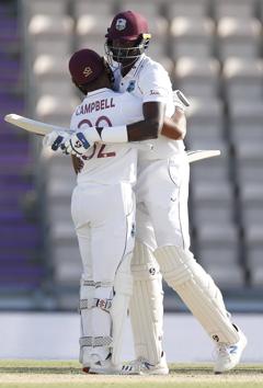 Southampton : West Indies captain Jason Holder, right, hugs teammate John Campbell after their win on the fifth day of the first cricket Test match between England and West Indies, at the Ageas Bowl in Southampton, England, Sunday, July 12, 2020. AP/PTI(AP12-07-2020_000274A) (AP)