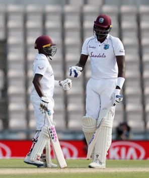 Cricket - First Test - England v West Indies - Rose Bowl Cricket Stadium, Southampton, Britain - July 12, 2020 West Indies' Jermaine Blackwood and Jason Holder, as play resumes behind closed doors following the outbreak of the coronavirus disease (COVID-19) Adrian Dennis/Pool via REUTERS (REUTERS)