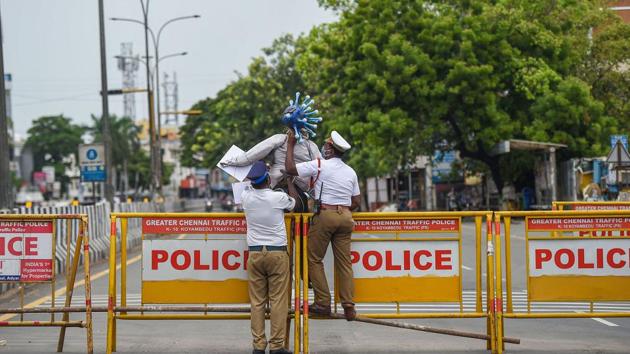 Chennai: Traffic police personnel block a road during lockdown as a preventive measure against the spread of coronavirus disease. (PTI) Chennai: Traffic police personnel block a road during lockdown as a preventive measure against the spread of coronavirus disease. (PTI)