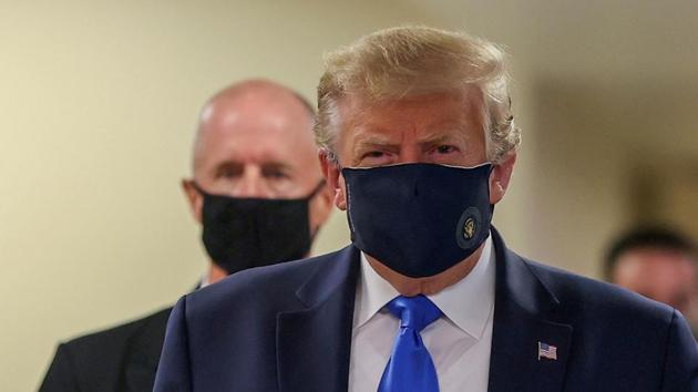 President Donald Trump wears a mask while visiting Walter Reed National Military Medical Center in Bethesda, Maryland, US.(REUTERS) President Donald Trump wears a mask while visiting Walter Reed National Military Medical Center in Bethesda, Maryland, US.(REUTERS)