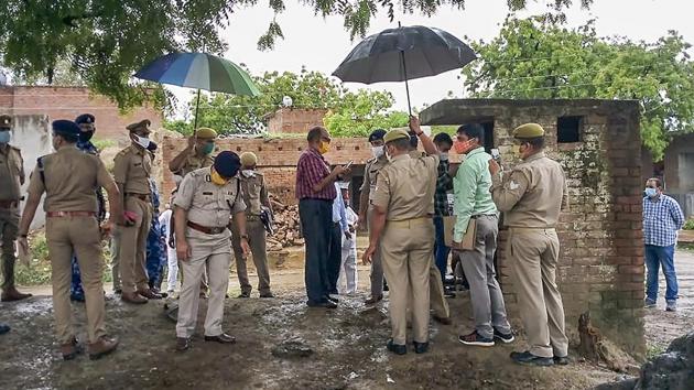 A Special Investigation Team visits the Bikru village, where eight policemen were killed by gangster Vikas Dubey on July 3, for investigation into the case, in Kanpur on Sunday. (PTI Photo) A Special Investigation Team visits the Bikru village, where eight policemen were killed by gangster Vikas Dubey on July 3, for investigation into the case, in Kanpur on Sunday. (PTI Photo)