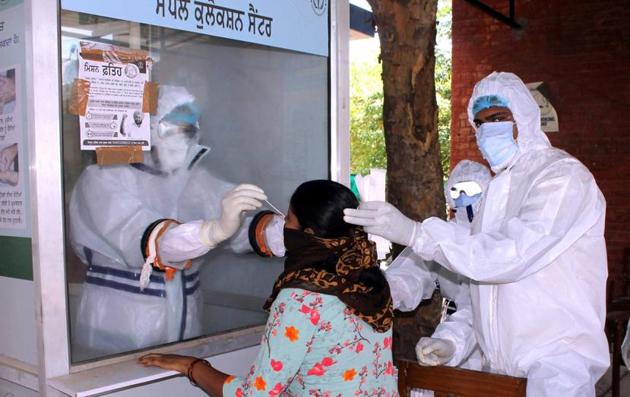 A swab sample being collected for testing. Besides the ortho department of the Guru Gobind Singh Medical College and Hospital, the OPD and cath lab have been closed, while the medical superintendent is also quarantined as he was in contact with positive patients. (HT file photo) A swab sample being collected for testing. Besides the ortho department of the Guru Gobind Singh Medical College and Hospital, the OPD and cath lab have been closed, while the medical superintendent is also quarantined as he was in contact with positive patients. (HT file photo)
