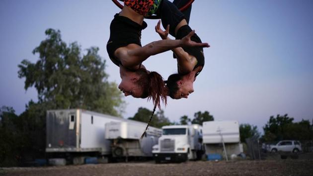 Lisa Varmbo Martonovich, left, and Nicole England-Czyzewski practice an aerial routine for "Gladius The Show," a touring equestrian and acrobatic show, Thursday, May 28, 2020, in Las Vegas. The coronavirus forced the producers to cancel all of their performances through 2020. (AP)