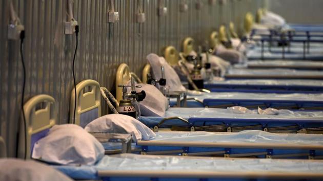 Empty beds with oxygen cylinders attached for Covid-19 patients at the Commonwealth Games Village Sports Complex, a temporary coronavirus care centre in Patparganj, New Delhi, on July 12.The national capital in the first 13 days of July has largely reported more cases of people recovering daily from the coronavirus than fresh ones being added to its Covid-19 count, data from the Delhi government shows. (Biplov Bhuyan / HT Photo)
