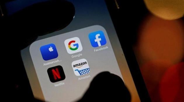 The logos of mobile apps, Google, Amazon, Facebook, Apple and Netflix, are displayed on a screen in this illustration picture.(Reuters File Photo)