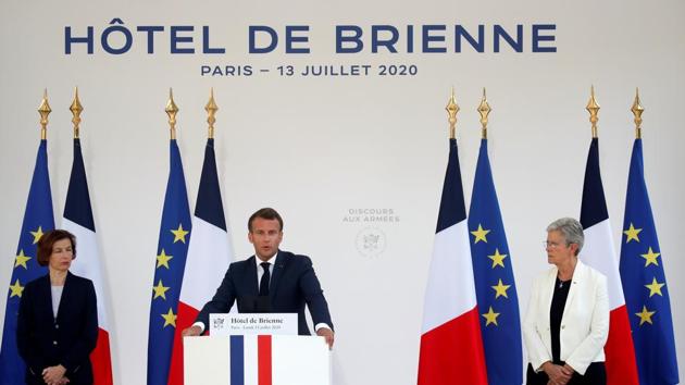 French President Emmanuel Macron is flanked by French Defence Minister Florence Parly and French Junior Minister for Veterans Genevieve Darrieussecq as he gives a speech to the French Military Forces at the Hotel de Brienne in Paris, France, July 13, 2020.(REUTERS/Gonzalo Fuentes/Pool)