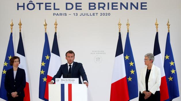 French President Emmanuel Macron is flanked by French Defence Minister Florence Parly and French Junior Minister for Veterans Genevieve Darrieussecq as he gives a speech to the French Military Forces at the Hotel de Brienne in Paris, France, July 13, 2020. (REUTERS/Gonzalo Fuentes)