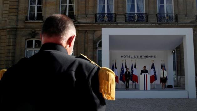 A member of the French Military Forces listens to a speech by French President Emmanuel Macron, flanked by French Defence Minister Florence Parly and French Junior Minister for Veterans Genevieve Darrieussecq, at the Hotel de Brienne in Paris, France, July 13, 2020. (REUTERS/Gonzalo Fuentes)