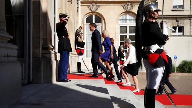 French President Emmanuel Macron and his wife Brigitte arrive before his speech to the French Military Forces at the Hotel de Brienne in Paris, France, July 13, 2020. (REUTERS/Gonzalo Fuentes)