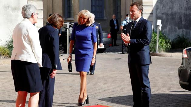 French President Emmanuel Macron and his wife Brigitte arrive before his speech to the French Military Forces at the Hotel de Brienne in Paris, France, July 13, 2020. (REUTERS/Gonzalo Fuentes)