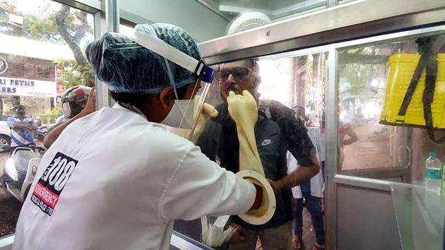 A health worker collect swab sample from a man for COVID-19 test, in Goa(ANI File) A health worker collect swab sample from a man for COVID-19 test, in Goa(ANI File)