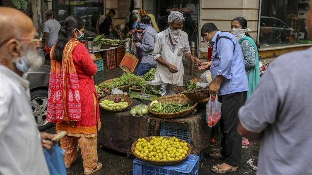 Shoppers wear protective masks while buying vegetables from a street stall in Mumbai on July 14. A health advisory by the Ministry of Health for elderly people notes that compared to the general population, they are at a higher risk due to decreased immunity as well as multiple associated comorbidities like diabetes, hypertension, kidney or pulmonary disease. (Dhiraj Singh / Bloomberg) Shoppers wear protective masks while buying vegetables from a street stall in Mumbai on July 14. A health advisory by the Ministry of Health for elderly people notes that compared to the general population, they are at a higher risk due to decreased immunity as well as multiple associated comorbidities like diabetes, hypertension, kidney or pulmonary disease. (Dhiraj Singh / Bloomberg)