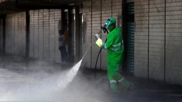 A municipal worker cleans and disinfects a sidewalk in Tepito on July 12. Mexican Deputy Health Minister Hugo Lopez-Gatell, the coronavirus czar, has continually walked back forecasts about when the crisis would peak, and has said the death toll and infection tally are likely higher than reported figures, HT reported, citing Reuters. (Claudio Cruz / AFP) A municipal worker cleans and disinfects a sidewalk in Tepito on July 12. Mexican Deputy Health Minister Hugo Lopez-Gatell, the coronavirus czar, has continually walked back forecasts about when the crisis would peak, and has said the death toll and infection tally are likely higher than reported figures, HT reported, citing Reuters. (Claudio Cruz / AFP)