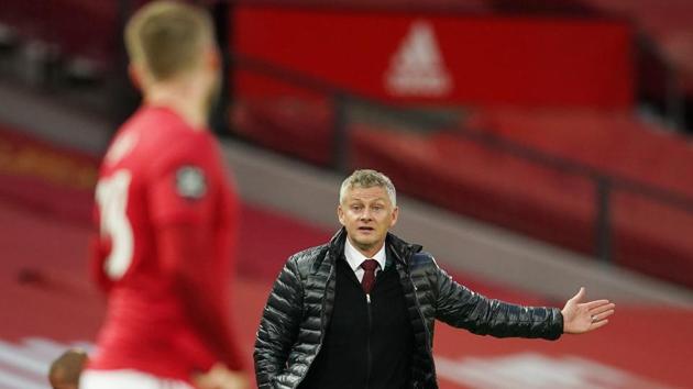Soccer Football - Premier League - Manchester United v Southampton - Old Trafford, Manchester, Britain - July 13, 2020 Manchester United manager Ole Gunnar Solskjaer reacts, as play resumes behind closed doors following the outbreak of the coronavirus disease (COVID-19) Pool via REUTERS/Dave Thompson EDITORIAL USE ONLY. No use with unauthorized audio, video, data, fixture lists, club/league logos or 'live' services. Online in-match use limited to 75 images, no video emulation. No use in betting, games or single club/league/player publications. Please contact your account representative for further details. (Pool via REUTERS) Soccer Football - Premier League - Manchester United v Southampton - Old Trafford, Manchester, Britain - July 13, 2020 Manchester United manager Ole Gunnar Solskjaer reacts, as play resumes behind closed doors following the outbreak of the coronavirus disease (COVID-19) Pool via REUTERS/Dave Thompson EDITORIAL USE ONLY. No use with unauthorized audio, video, data, fixture lists, club/league logos or 'live' services. Online in-match use limited to 75 images, no video emulation. No use in betting, games or single club/league/player publications. Please contact your account representative for further details. (Pool via REUTERS)