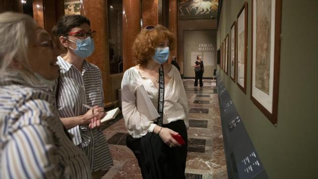 Visitors wearing face masks, look at the exhibition From Durer to Matisse Selected drawings from the collection of the Pushkin State Museum of Fine Arts in Moscow, Russia. (AP PHOTO/Alexander Zemlianichenko Jr) Visitors wearing face masks, look at the exhibition From Durer to Matisse Selected drawings from the collection of the Pushkin State Museum of Fine Arts in Moscow, Russia. (AP PHOTO/Alexander Zemlianichenko Jr)