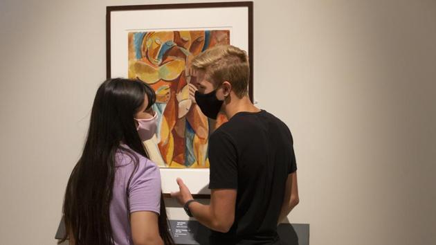 Visitors wearing face masks to protect against coronavirus, stand by Pablo Picasso's art work Friendship II at the exhibition From Durer to Matisse Selected drawings from the collection of the Pushkin State Museum of Fine Arts in Moscow, Russia. (AP PHOTO/Alexander Zemlianichenko Jr) Visitors wearing face masks to protect against coronavirus, stand by Pablo Picasso's art work Friendship II at the exhibition From Durer to Matisse Selected drawings from the collection of the Pushkin State Museum of Fine Arts in Moscow, Russia. (AP PHOTO/Alexander Zemlianichenko Jr)