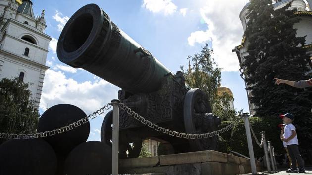 Children look at the Tsar Cannon in the Kremlin in Moscow, Russia, Friday, July 10, 2020. (AP) Children look at the Tsar Cannon in the Kremlin in Moscow, Russia, Friday, July 10, 2020. (AP)