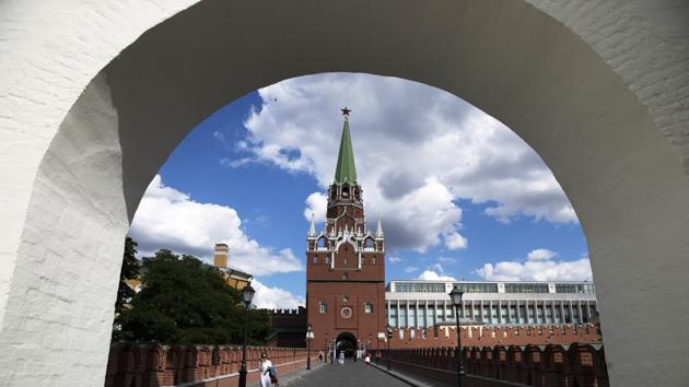 A woman walks on the Troitsky Bridge in the Kremlin in Moscow, Russia, Friday, July 10, 2020, with the Troitskaya Tower in the background. The first Russian monument to become part of UNESCO world heritage 30 years ago, Moscow’s Kremlin Museums struggle to finance restoration works amid coronavirus outbreak and move freeze most of the projects until the next year. (AP) A woman walks on the Troitsky Bridge in the Kremlin in Moscow, Russia, Friday, July 10, 2020, with the Troitskaya Tower in the background. The first Russian monument to become part of UNESCO world heritage 30 years ago, Moscow’s Kremlin Museums struggle to finance restoration works amid coronavirus outbreak and move freeze most of the projects until the next year. (AP)