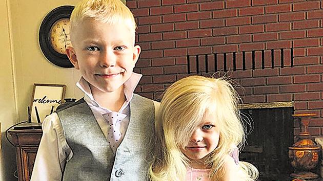 The heroic tale of six-year-old Bridger, saving his younger sister from a dog, has gone viral.