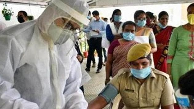 Bangalore City Police and Nightingales Medical Trust jointly organised "Covid-19" health checkup to police Personnel at Police Commissioner Office in Bengaluru.(ANI) Bangalore City Police and Nightingales Medical Trust jointly organised "Covid-19" health checkup to police Personnel at Police Commissioner Office in Bengaluru.(ANI)