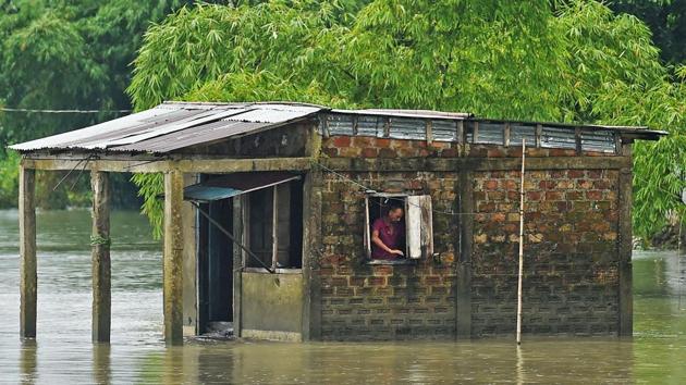 A man stands inside his flooded house in Sunamgong on July 15. “This is going to be the worst flood in a decade,” Bangladesh’s Flood Forecasting and Warning Centre chief Arifuzzaman Bhuiyan told AFP. Heavy rains have swollen two main Himalayan river systems -- the Brahmaputra and the Ganga -- that flow through India and Bangladesh. (Munir uz Zaman / AFP) 