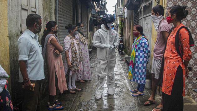 Among the several preventive measures adopted in Mumbai, a medical team conducts thermal screening using a smart helmet.(PTI Photo) Among the several preventive measures adopted in Mumbai, a medical team conducts thermal screening using a smart helmet.(PTI Photo)