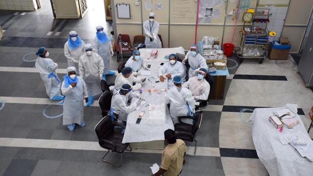 A team of medical workers dedicated to coronavirus patients seen taking a break inside a ward at LNJP hospital on July 14. As of July 14, out of the total 15, 253 beds in hospitals, 10, 944 are vacant; of 9, 217 beds at dedicated Covid care centre, 7, 069 beds are vacant for Covid-19 patients. (Raj K Raj / HT Photo) A team of medical workers dedicated to coronavirus patients seen taking a break inside a ward at LNJP hospital on July 14. As of July 14, out of the total 15, 253 beds in hospitals, 10, 944 are vacant; of 9, 217 beds at dedicated Covid care centre, 7, 069 beds are vacant for Covid-19 patients. (Raj K Raj / HT Photo)