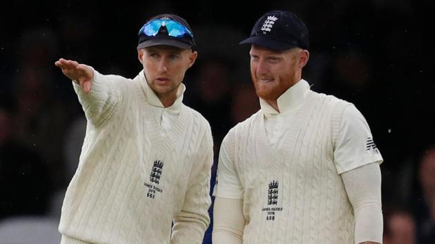 (FILES) In this file photo taken on August 16, 2019 England's captain Joe Root (L) and England's Ben Stokes talk between balls on (AFP) (FILES) In this file photo taken on August 16, 2019 England's captain Joe Root (L) and England's Ben Stokes talk between balls on (AFP)