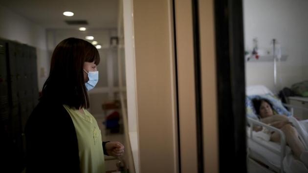Health care worker Raquel Benitez observes a COVID-19 patient at the Eurnekian Ezeiza Hospital on the outskirts of Buenos Aires, Argentina, Tuesday, July 14, 2020, during a government-ordered lockdown to curb the spread of the new coronavirus. (Representational) (AP) Health care worker Raquel Benitez observes a COVID-19 patient at the Eurnekian Ezeiza Hospital on the outskirts of Buenos Aires, Argentina, Tuesday, July 14, 2020, during a government-ordered lockdown to curb the spread of the new coronavirus. (Representational) (AP)