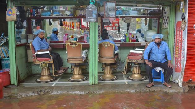 Workers sit inside a salon on a waterlogged street following heavy rainfall in Mumbai July 15. Considering the turn of events as the day progressed, the IMD upgraded it’s alert from orange to red in the afternoon, warning of “heavy to very heavy rainfall” with isolated “extremely heavy falls” as very likely in the next 18 hours, PTI reported. (Mitesh Bhuvad / PTI) Workers sit inside a salon on a waterlogged street following heavy rainfall in Mumbai July 15. Considering the turn of events as the day progressed, the IMD upgraded it’s alert from orange to red in the afternoon, warning of “heavy to very heavy rainfall” with isolated “extremely heavy falls” as very likely in the next 18 hours, PTI reported. (Mitesh Bhuvad / PTI)