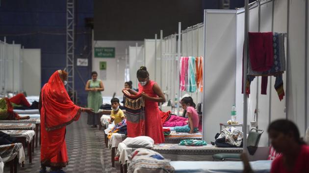 Covid-19 patients seen inside the Commonwealth Games Village Sports Complex which is temporarily converted into a coronavirus care centre, at Patparganj in New Delhi on Tuesday. (Sanchit Khanna/HT Photo) Covid-19 patients seen inside the Commonwealth Games Village Sports Complex which is temporarily converted into a coronavirus care centre, at Patparganj in New Delhi on Tuesday. (Sanchit Khanna/HT Photo)
