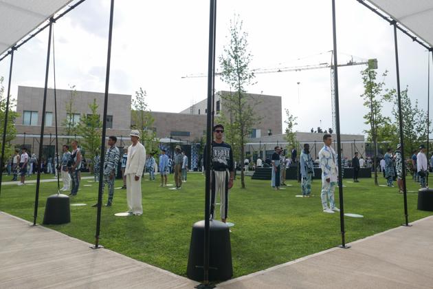 Models practice social distancing as they present creations by Dolce and Gabbanna during the men Spring-Summer 2021 fashion collection shows as part of the Milano Digital Fashion Week on July 15, 2020 at Humanitas university gardens in Rozzano near Milan, as they respect social distancing. (AFP)