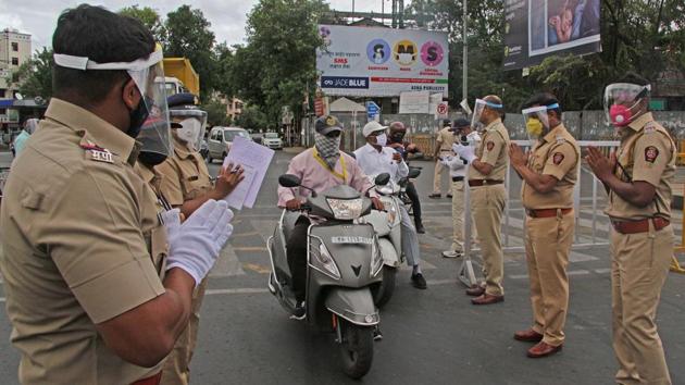 Police personnel make gestures requesting people that they stay at home as a fresh 10-day lockdown in enforced in Pune on July 13. Areas around the world that had been previously simmering, others that had thought the worst was over are tightening or reimposing restrictions in hopes of tackling new outbreaks before they spin out of control. (Ravindra Joshi / HT Photo) Police personnel make gestures requesting people that they stay at home as a fresh 10-day lockdown in enforced in Pune on July 13. Areas around the world that had been previously simmering, others that had thought the worst was over are tightening or reimposing restrictions in hopes of tackling new outbreaks before they spin out of control. (Ravindra Joshi / HT Photo)