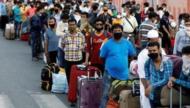 Migrant workers and their families wait in lines outside a railway station to board a train to their home state West Bengal, after authorities eased lockdown restrictions that were imposed to slow the spread of the coronavirus disease (Covid-19) in Ahmedabad on June 18, 2020.(Reuters File Photo) Migrant workers and their families wait in lines outside a railway station to board a train to their home state West Bengal, after authorities eased lockdown restrictions that were imposed to slow the spread of the coronavirus disease (Covid-19) in Ahmedabad on June 18, 2020.(Reuters File Photo)