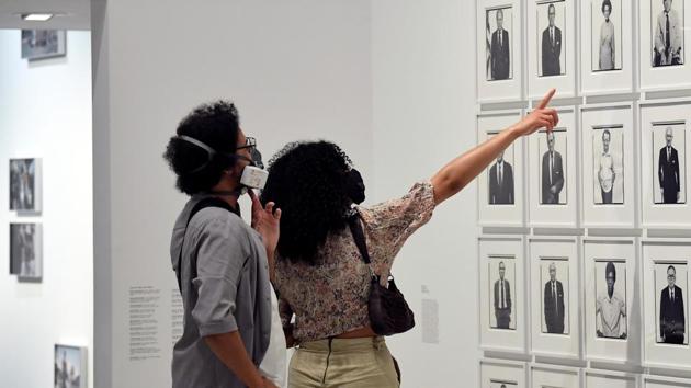 Visitors view photographs in the exhibition Masculinities at the Barbican arts centre. (REUTERS/Toby Melville) Visitors view photographs in the exhibition Masculinities at the Barbican arts centre. (REUTERS/Toby Melville)