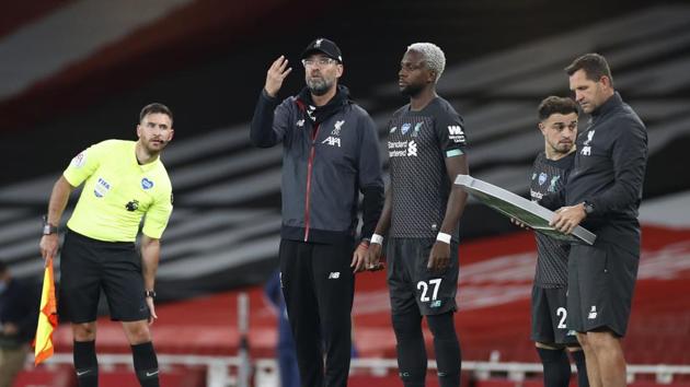 Liverpool manager Juergen Klopp and substitute Divock Origi (REUTERS) Liverpool manager Juergen Klopp and substitute Divock Origi (REUTERS)