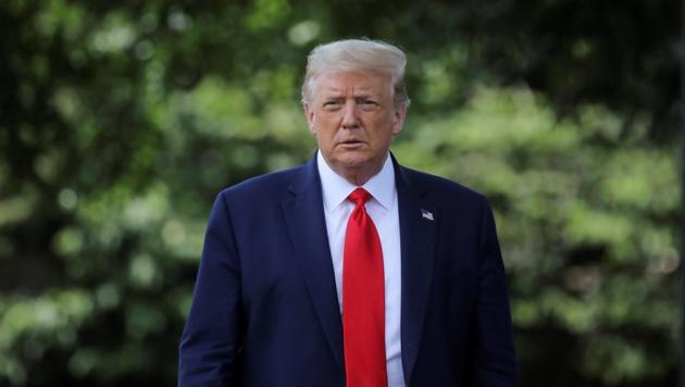US president Donald Trump walks toward reporters as he departs for travel to Atlanta, Georgia from the South Lawn at the White House in Washington, US on July 15, 2020. (Reuters Photo)
