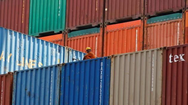 A worker sits on a ship carrying containers at Mundra Port in the western Indian state of Gujarat. (Reuters) A worker sits on a ship carrying containers at Mundra Port in the western Indian state of Gujarat. (Reuters)
