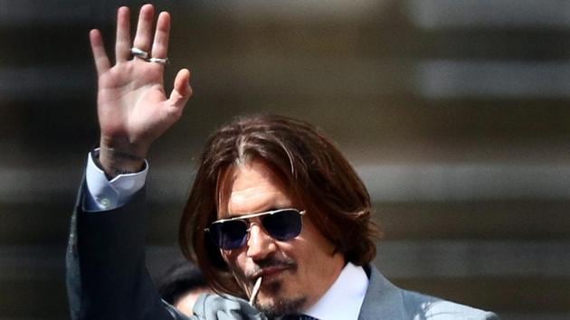 Actor Johnny Depp waves as he leaves the High Court in London.(REUTERS) Actor Johnny Depp waves as he leaves the High Court in London.(REUTERS)